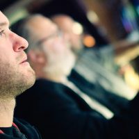 Man at a slot machine.