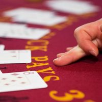 Dealers hand on a blackjack table