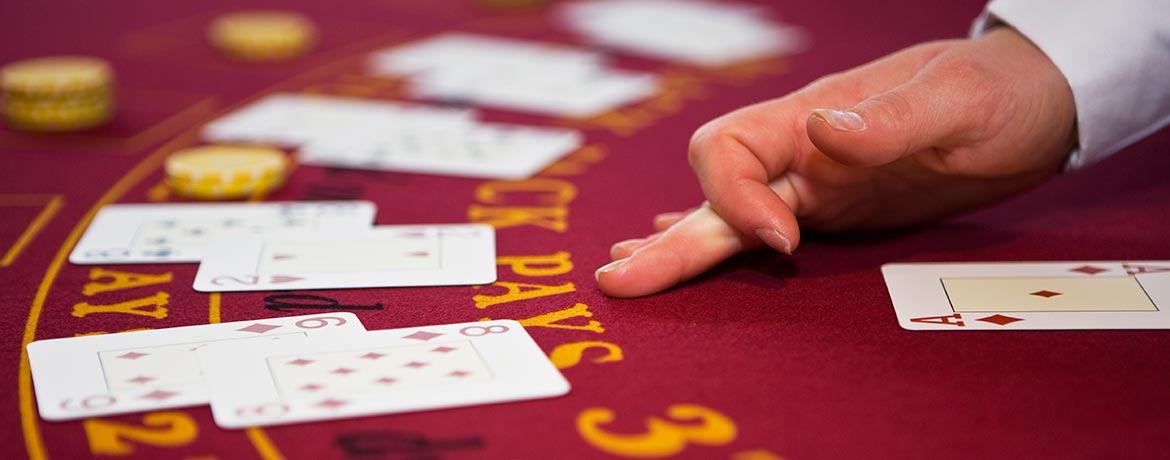Dealers hand on a blackjack table