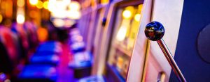The inside of a casino, showing slot machines