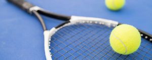 A tennis racket and ball.
